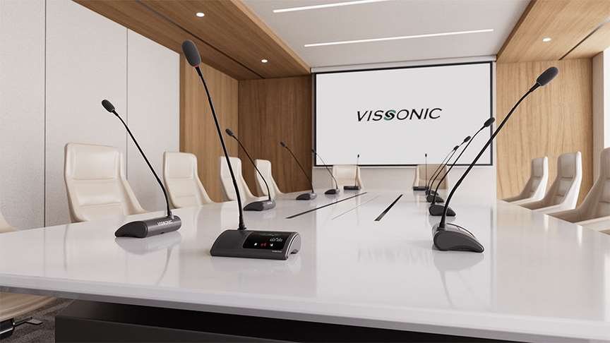 Conference room with digital microphone system, presentation screen and seating